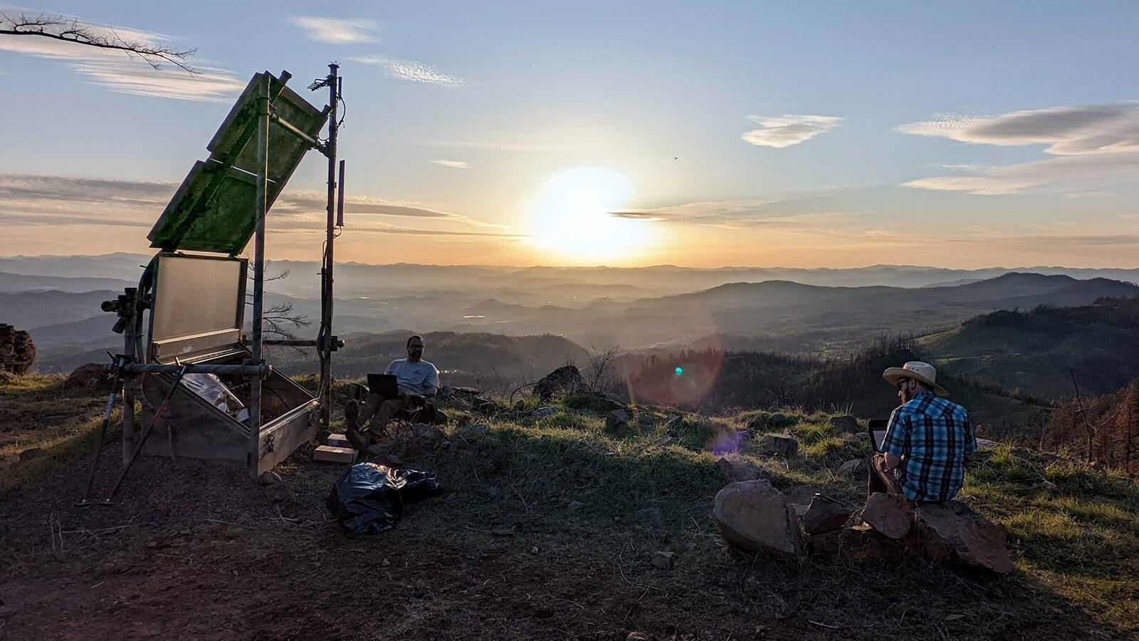 sunset over field engineers building new new GPS and seismic site