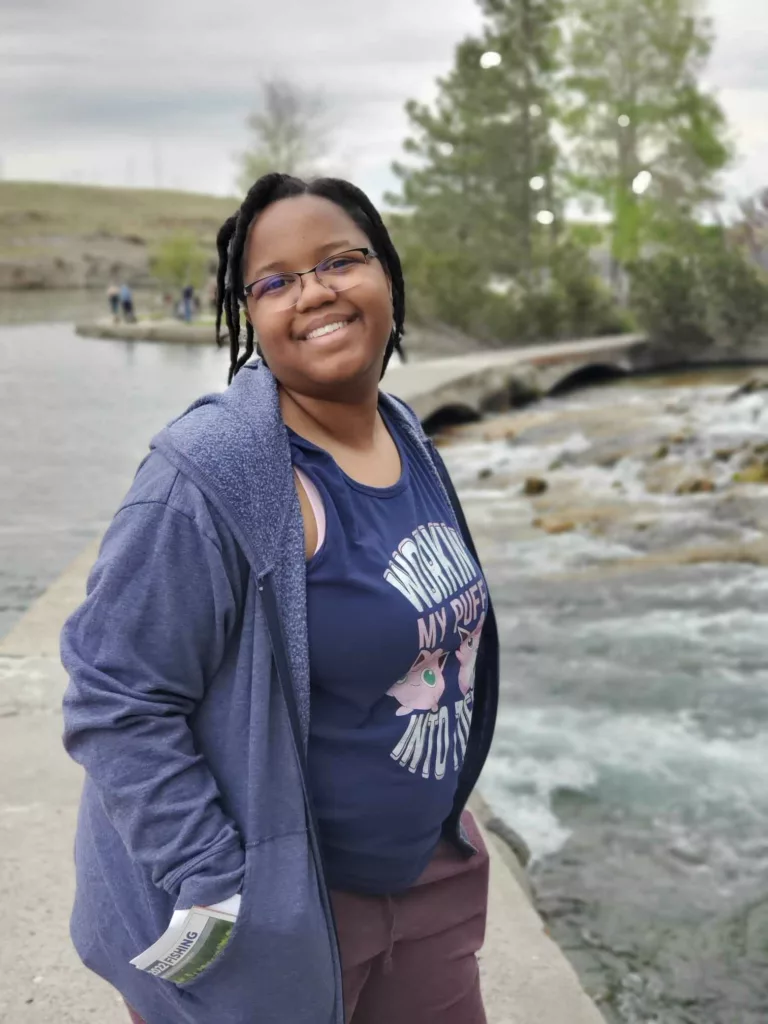 Kristin smiling in front of a river
