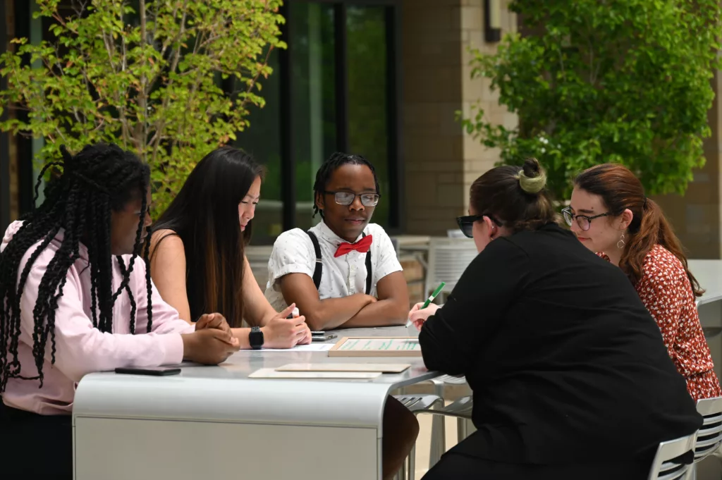 photo of six interns working at a table