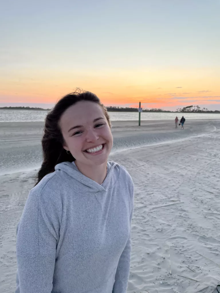 Headshot of Bailey Fitzgerald smiling on the beach.