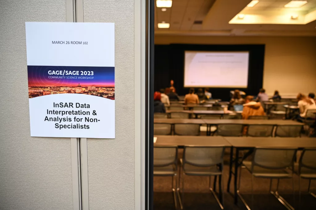 a sign on the door to a room where a presentation is occurring reads InSAR data interpretation and analysis for non-specialists