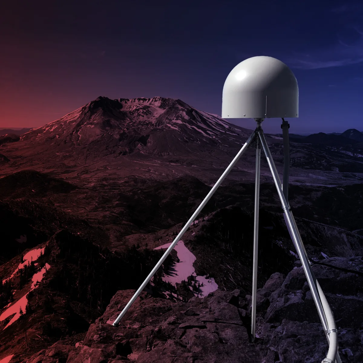 Photo of GPS station antenna in foreground and Mount St. Helens in the distance.